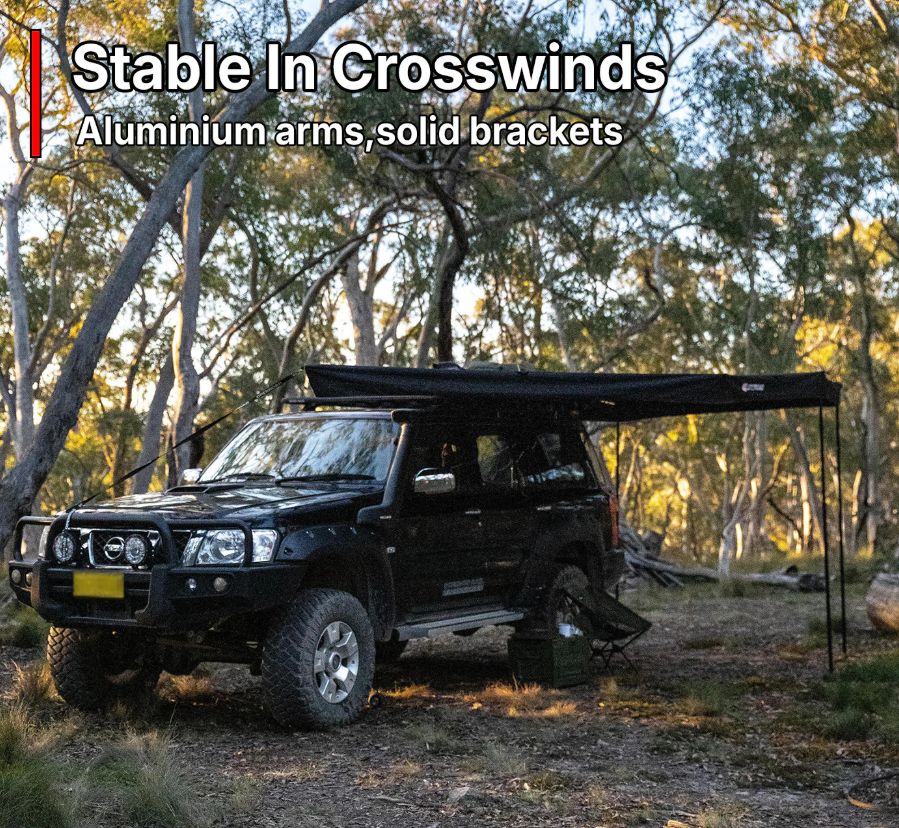 OPENROAD 270° Plus Awning stable in crosswinds with aluminium arms on off-road vehicle in forest